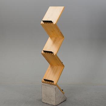 A "Zink" magazine rack, designed by Jonas Bohlin in 1984 for Källemo AB.