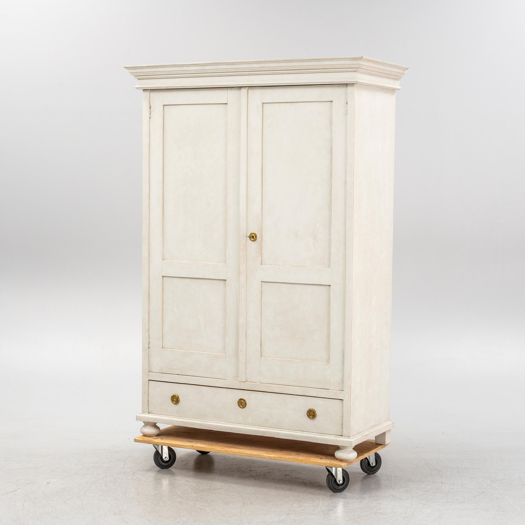 A painted clothes cabinet, 21st Century.