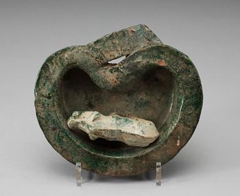 A green glazed heart shaped pigsty with pig, Han dynasty (206 BC- 220 AD).