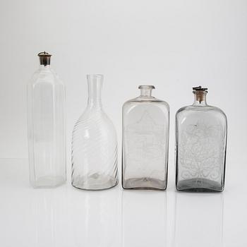 A set of four 19th/20th century glass decanters.