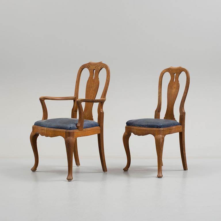 a set of eight rococo-style oak chairs from the 20th century.