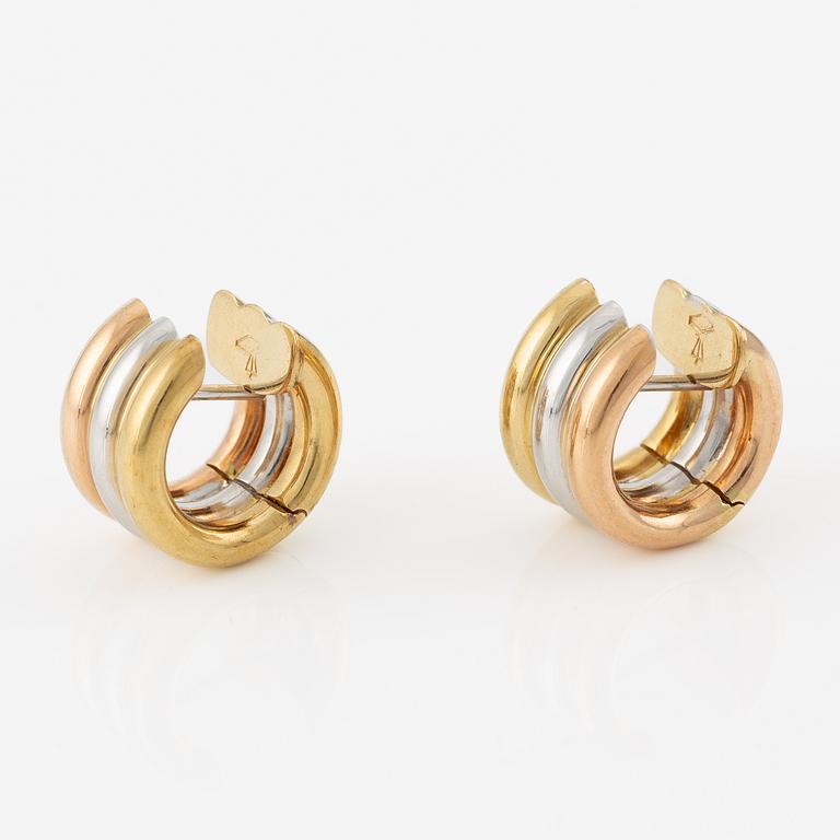 A pair of earrings in 18K gold in three colours.