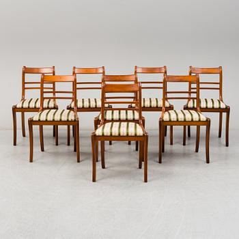 A yew dining table and 8 chairs, second half of the 20th century.