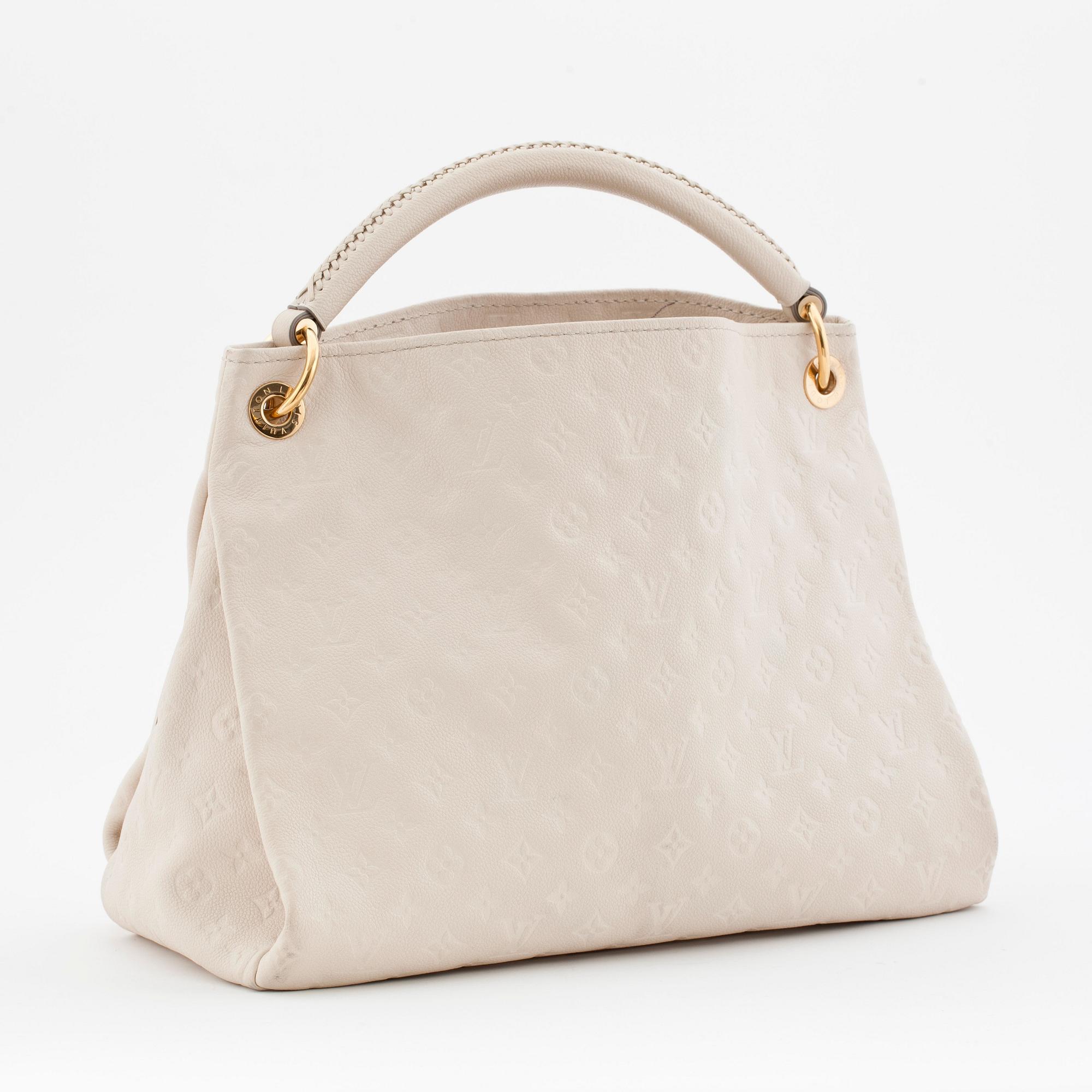 LOUIS VUITTON, a creme colored shoulder bag with embossed monogram print, "Artsy MM".