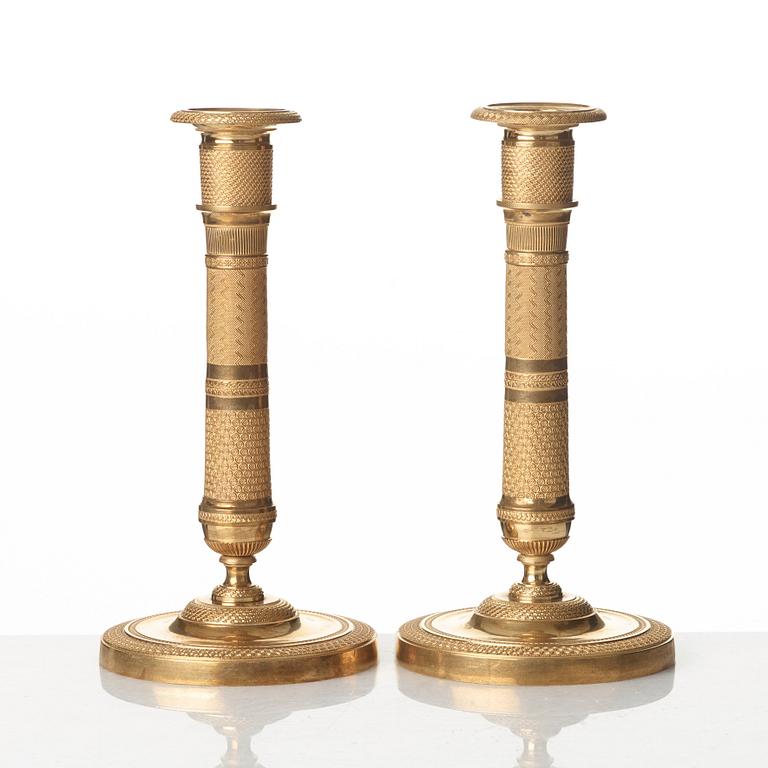 A pair of French Empire candlesticks, early 19th century.