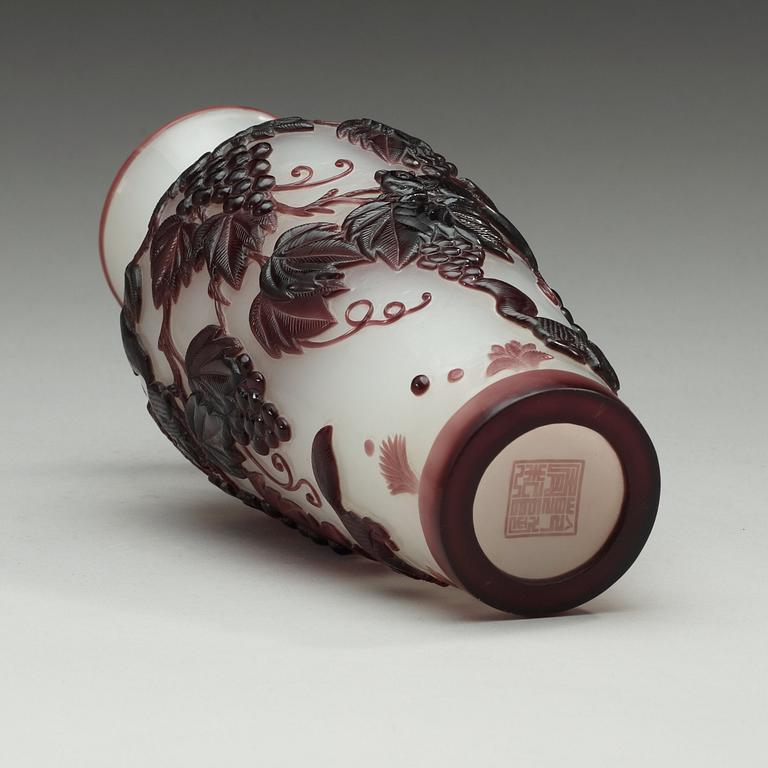 A Chinese purple overlay peking glass vase, 20th Century.