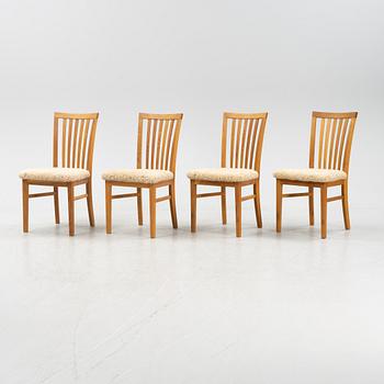 A set of four oak chairs with new  sheepskin upholstery.