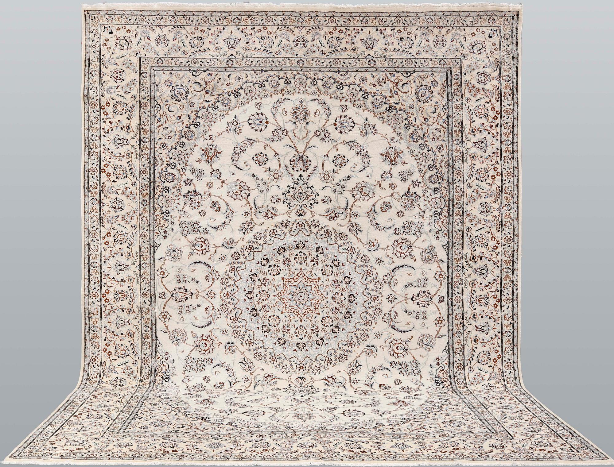 A Nain part-silk carpet, 395 x 293 cm.