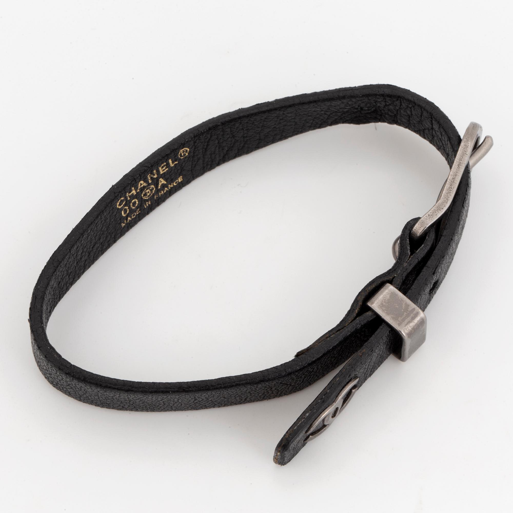 CHANEL, a leather bracelet.