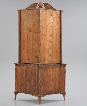 A rococo corner cabinet, later part 18th century.
