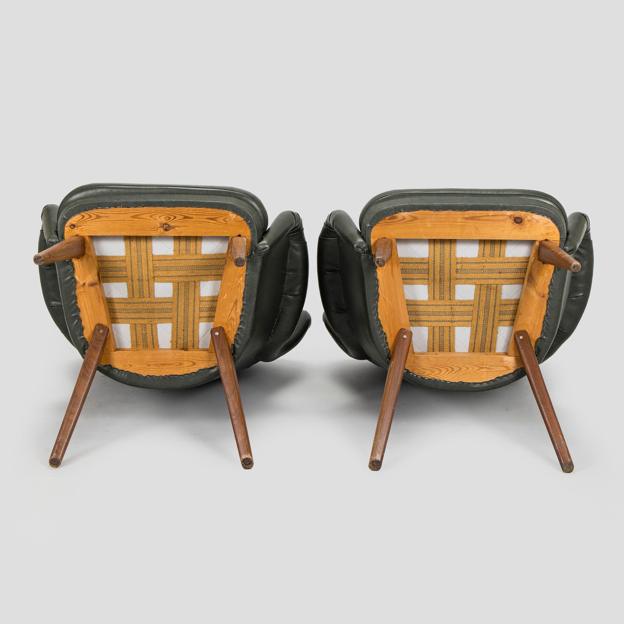 A pair of mid-20th century armchairs.