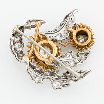 A platinum and 18K gold brooch with an old-cut diamond approximately 1.50 cts.