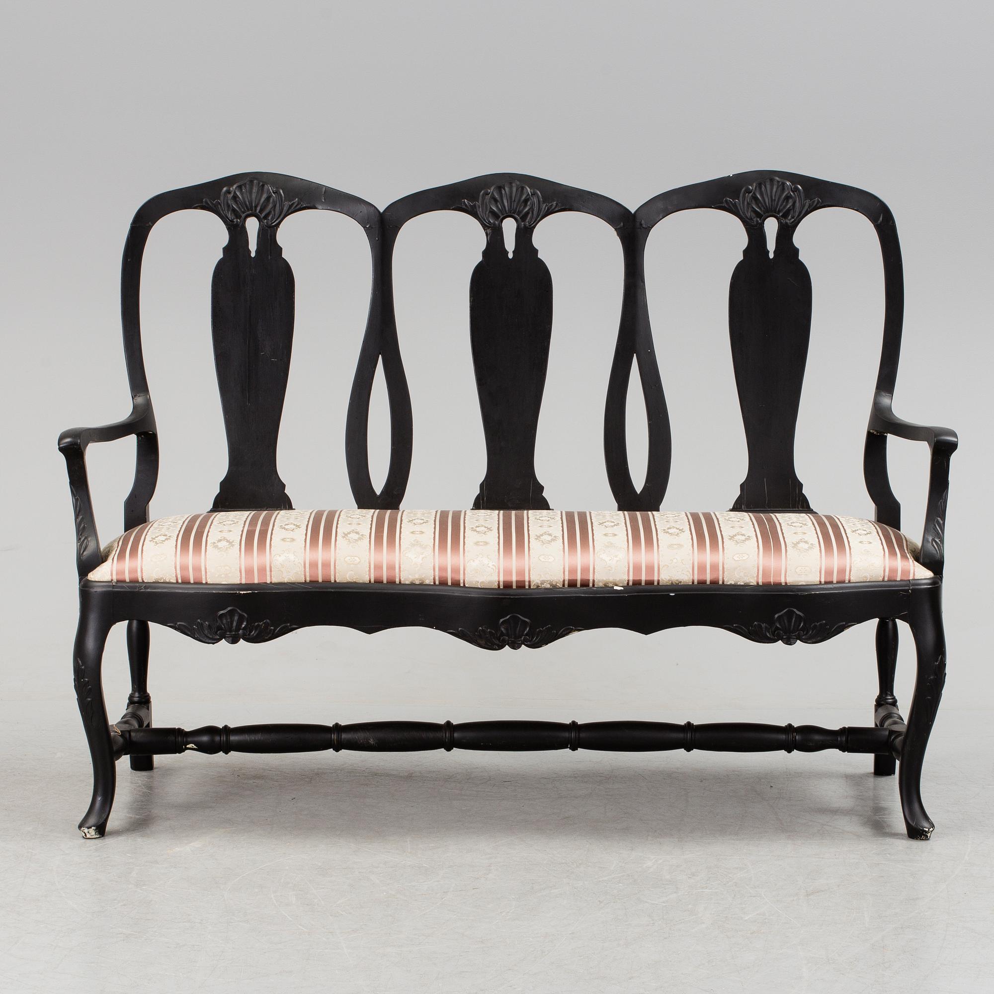A mid 1900s rococo style sofa.