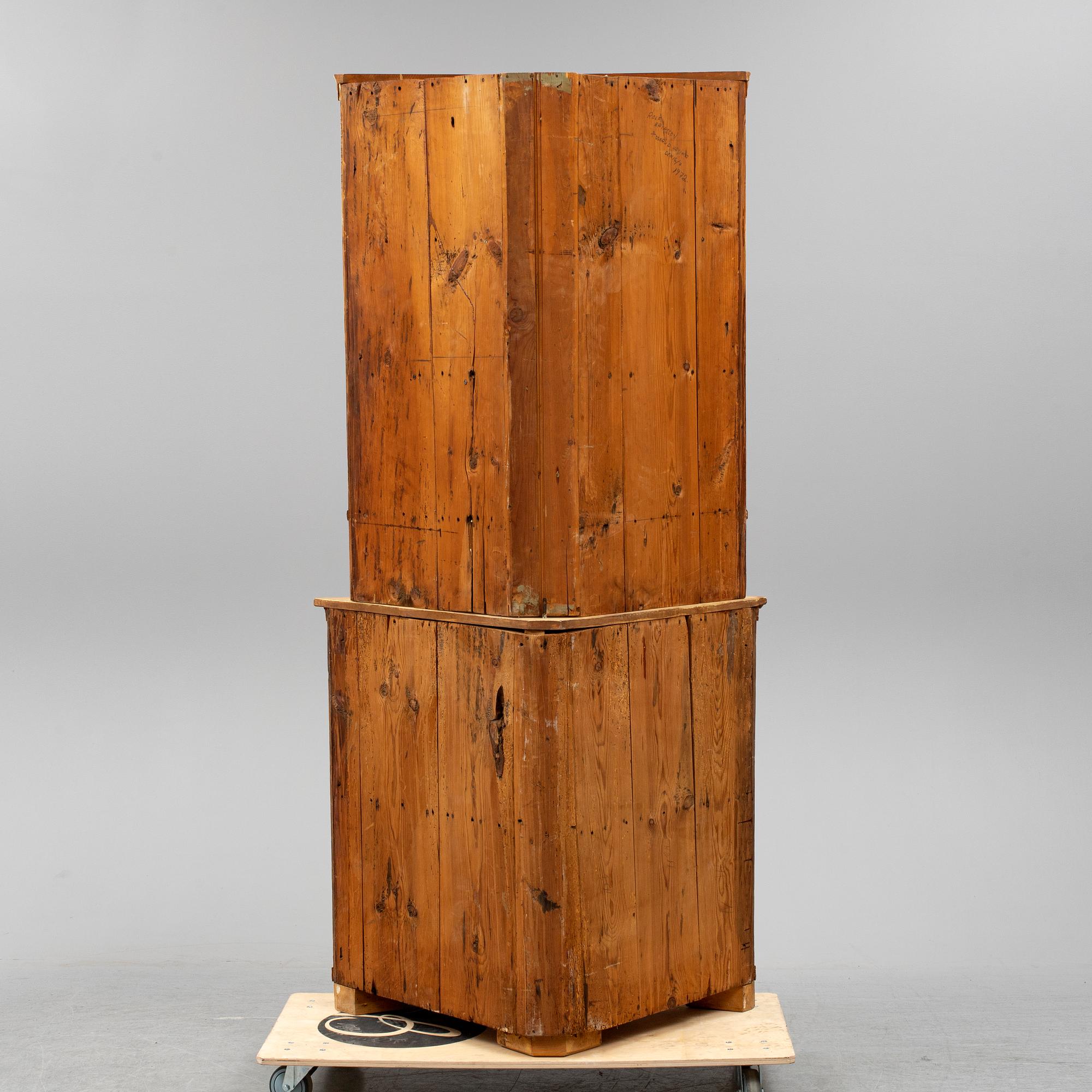 A Swedish late Gustavian corner cabinet in two parts.