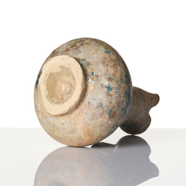 A turquoise-glazed Keshan jug, Persian, 13th century.