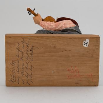 HERMAN ROSELL, a painted wooden sculpture.