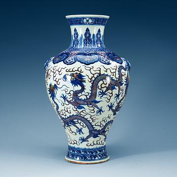 1876. A large blue and white and red dragon vase, Qing dynasty, with Qianlong seal mark.