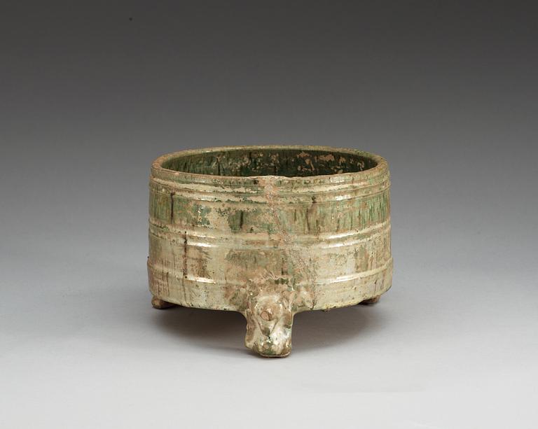 A green glazed tripod censer, Han dynasty (206 BC – 220 AD).