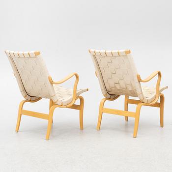 Bruno Mathsson, a pair of 'Eva' armchairs, DUX, Sweden, second half of the 20th century.