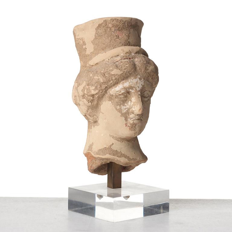 A pottery head of an elegant lady, Hellenistic, presumably 5th-3rd Century B.C.