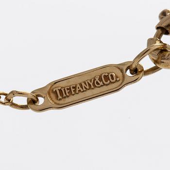 Tiffany & Co, an 18K gold necklace with diamonds.