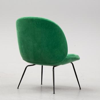 A 'Beetle Lounge Chair' by GamFratesi for Gubi, designed 2013.