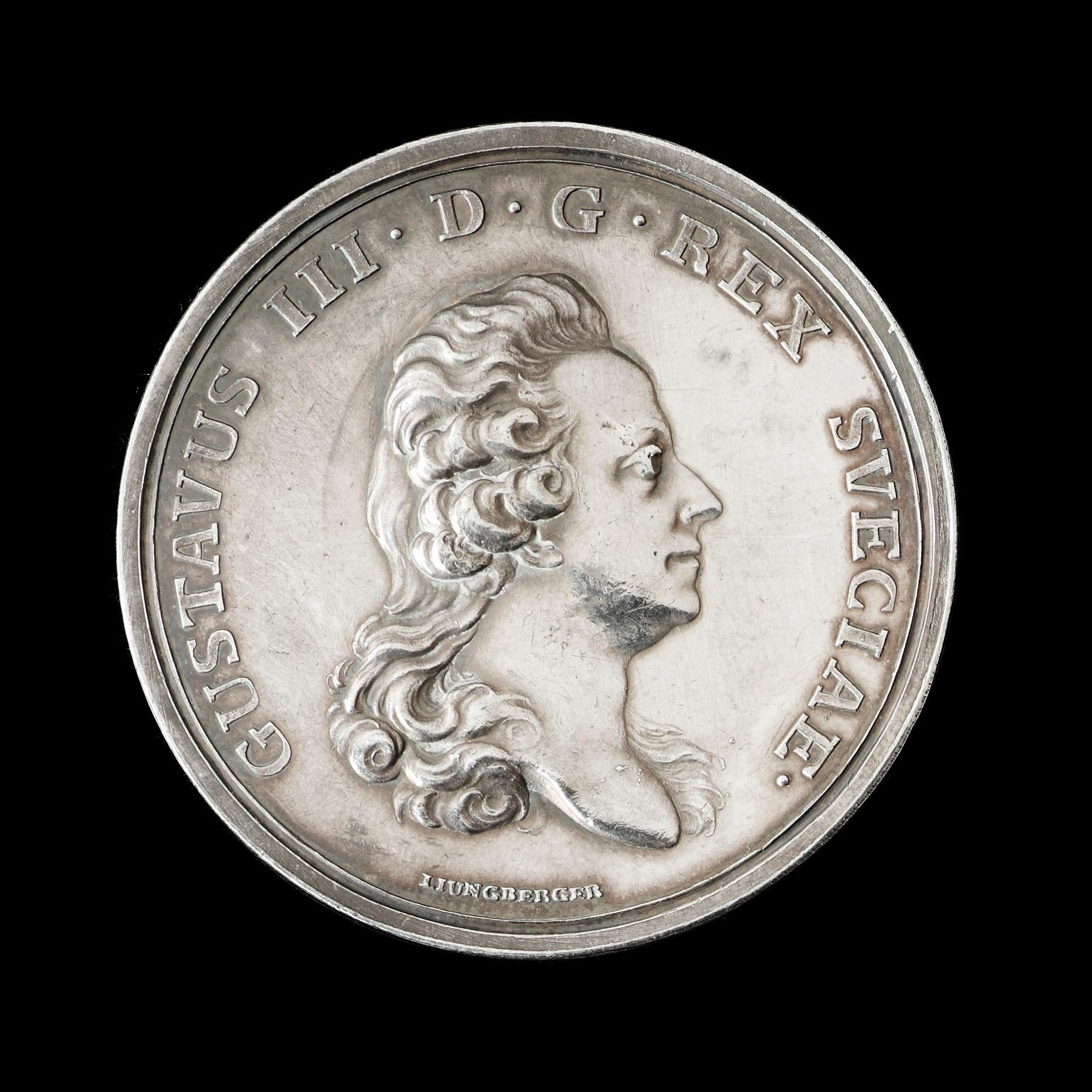 MEDALJ. Gustav III:s karusell/tornering på Drottningholm 1785. Utförd av G. Liungberger/C.G. Fehrman. Silver 4,2 cm 29 g.
