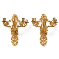 A pair of French 19th century gilt bronze five-light wall-lights.