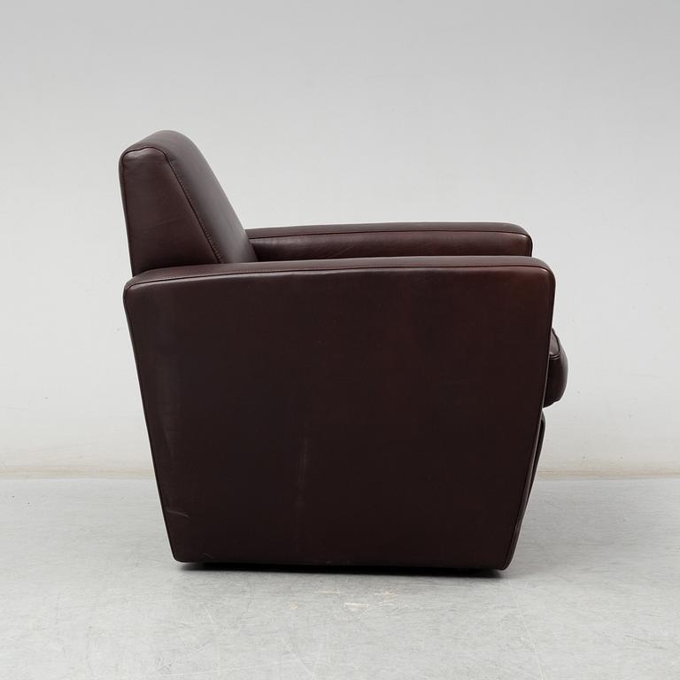 A contemporary brown leather easy chair from Moroso.