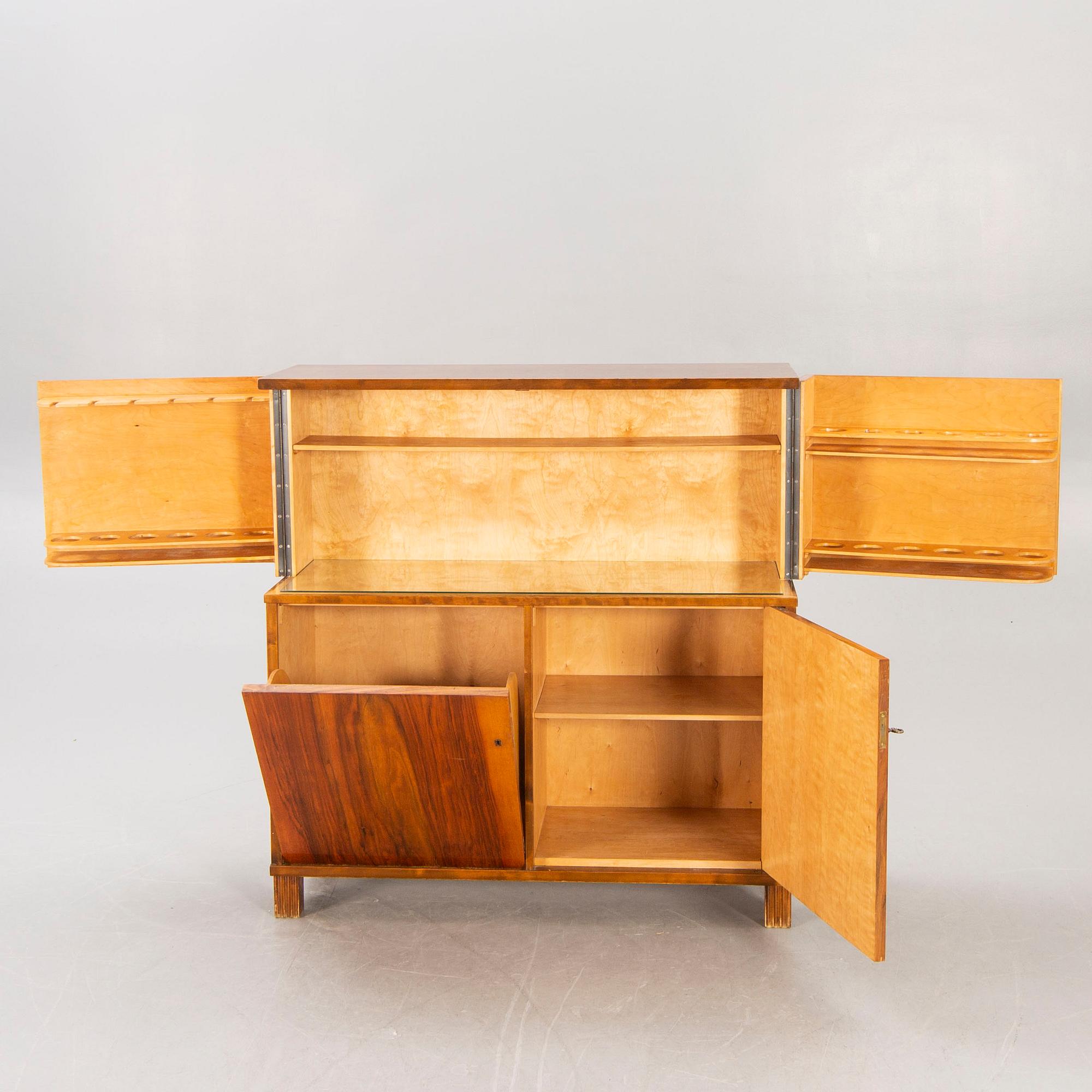A 1930s birch bar cabinet.