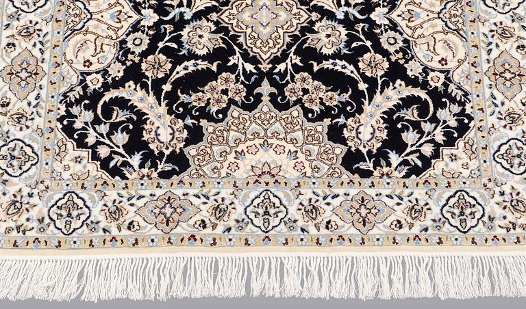 A Nain runner carpet, part silk Sk 6LAA, 337 x 103 cm.
