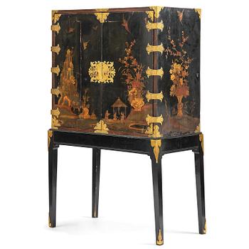 176. A presumably German black and gilt-japanned cabinet, mid 18th century.