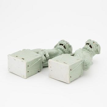 A pair of celadon glazed figures of buddhist lions, China, 20th Century.