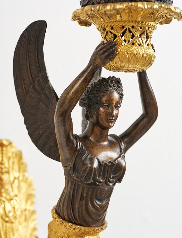 A pair of French Empire five-branch gilt and patinated bronze appliques, first part 19th century.