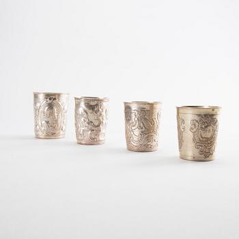 Five Russian 18th century silver and brass beakers, silver weight 292 gr, height ca 7-8,5 cm.