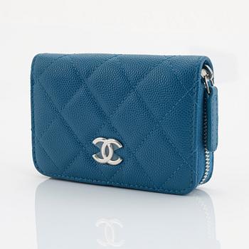 Chanel, a blue caviar leather wallet.