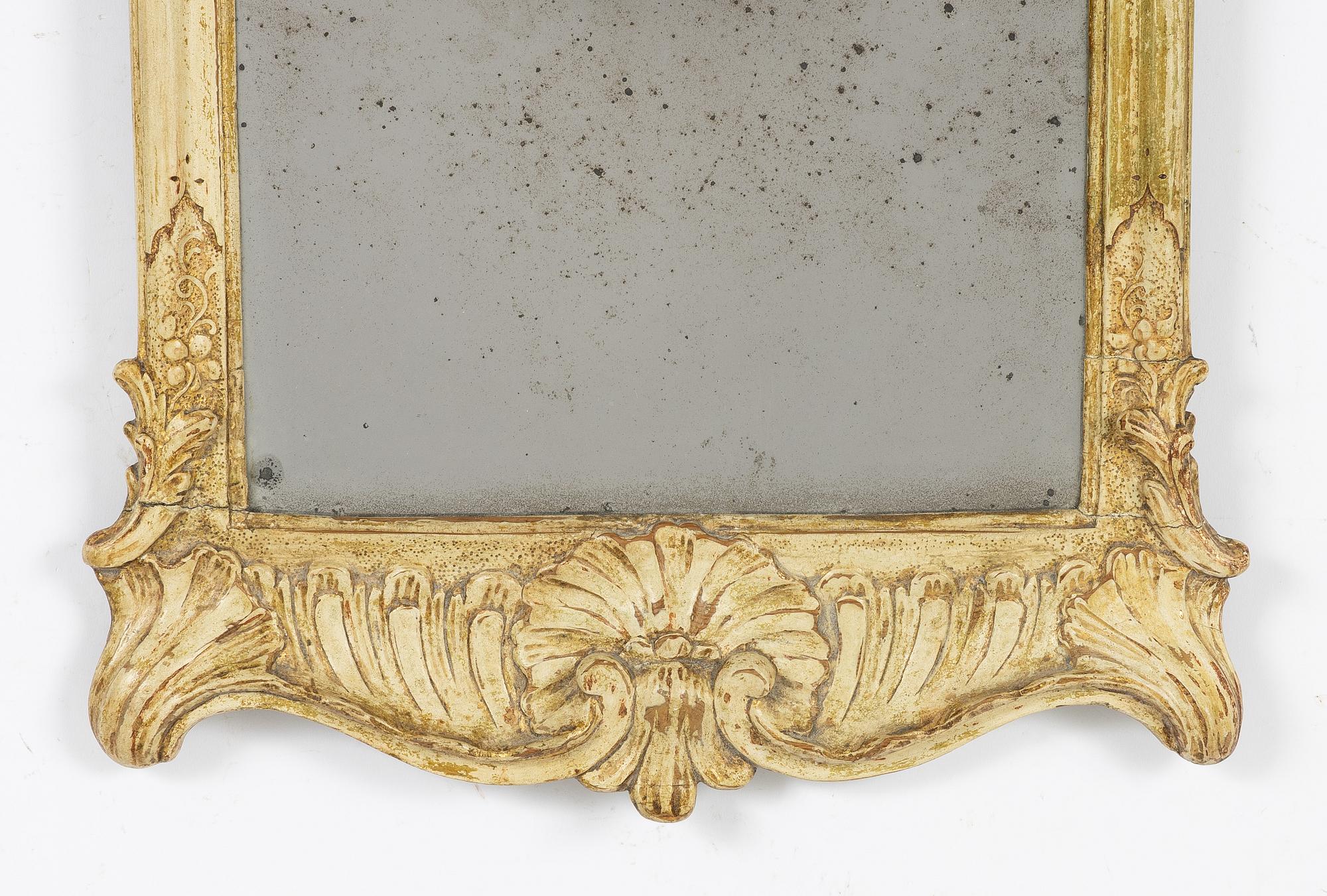 A giltwood rococo mirror, Stockholm, mid 18th century.