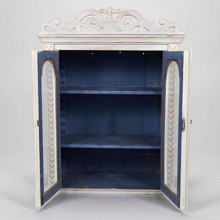 A late 19th-century wooden wall cabinet.