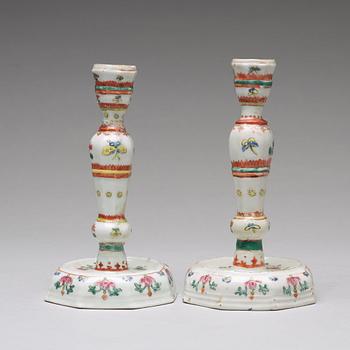 A pair of famille rose candle sticks, Qing dynasty, Qianlong (1736-95).