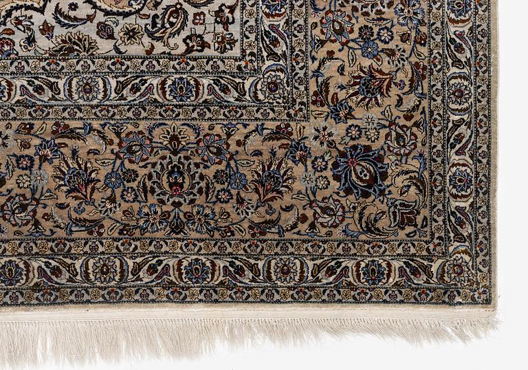 A semi-antique silk Keshan carpet, c. 350 x 248 cm.