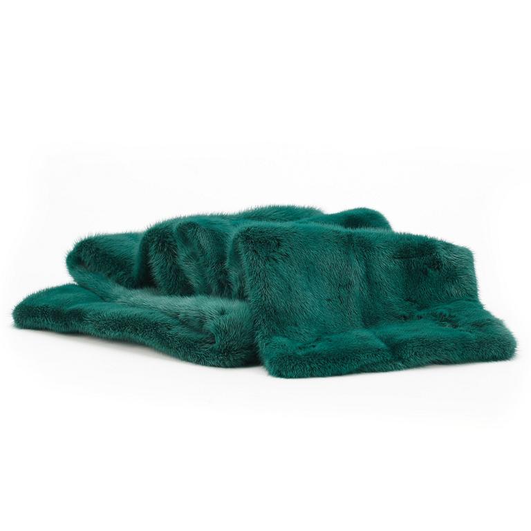 BVLGARI, a green mink stole.