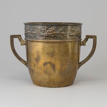 A brass jugend-style champagne cooler from early 21 st century.