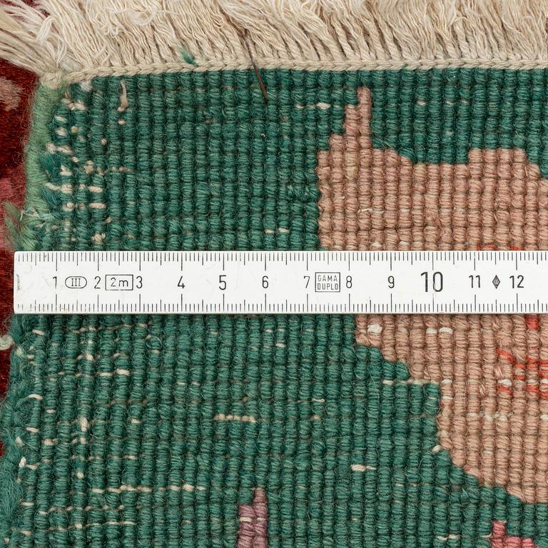 A semi-antique chinese carpet, ca 338 x 266 cm.