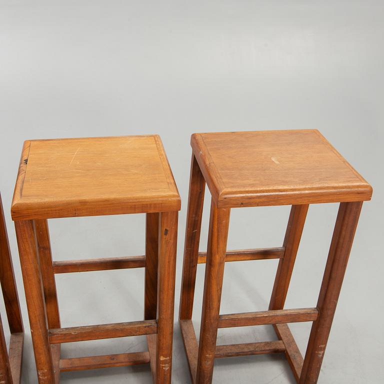 Four bar stools, 20th century.