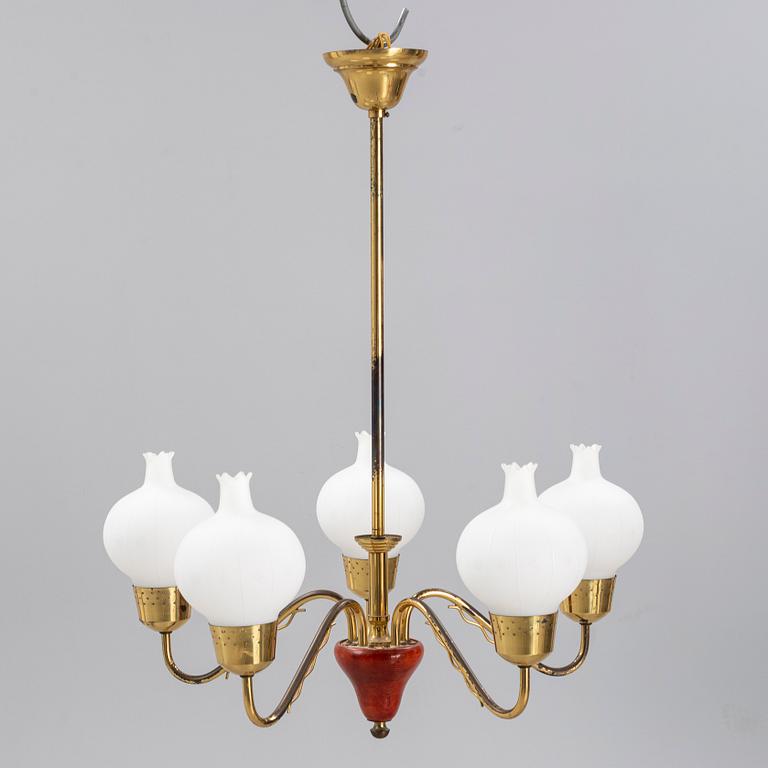 A 1950's glass and brass ceiling light.
