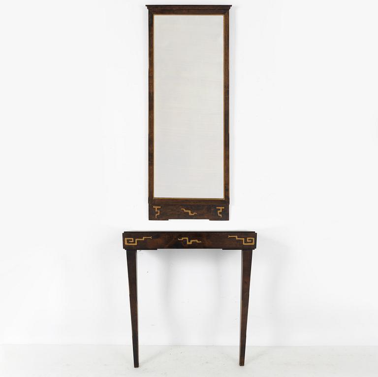 A Swedish Grace mirror and a console table, 1920's/30's.
