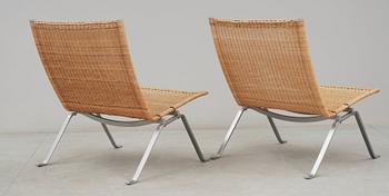 A pair of Poul Kjaerholm 'PK-22' steel and rattan easy chairs, Fritz Hansen, Denmark.