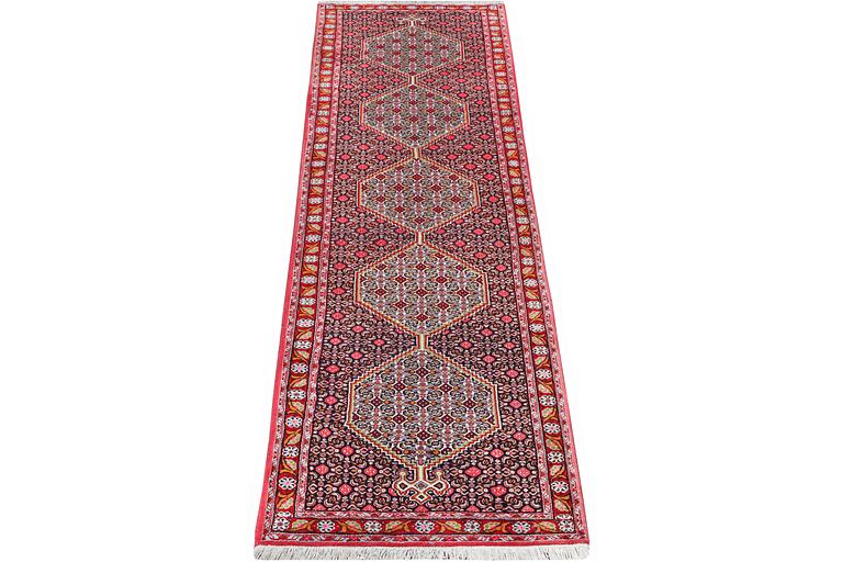 A Runner carpet, Senneh, c. 325 x 80 cm.