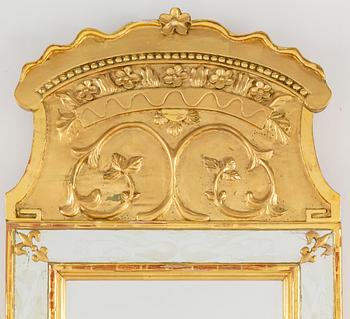 An empire style mirror, 20th century.