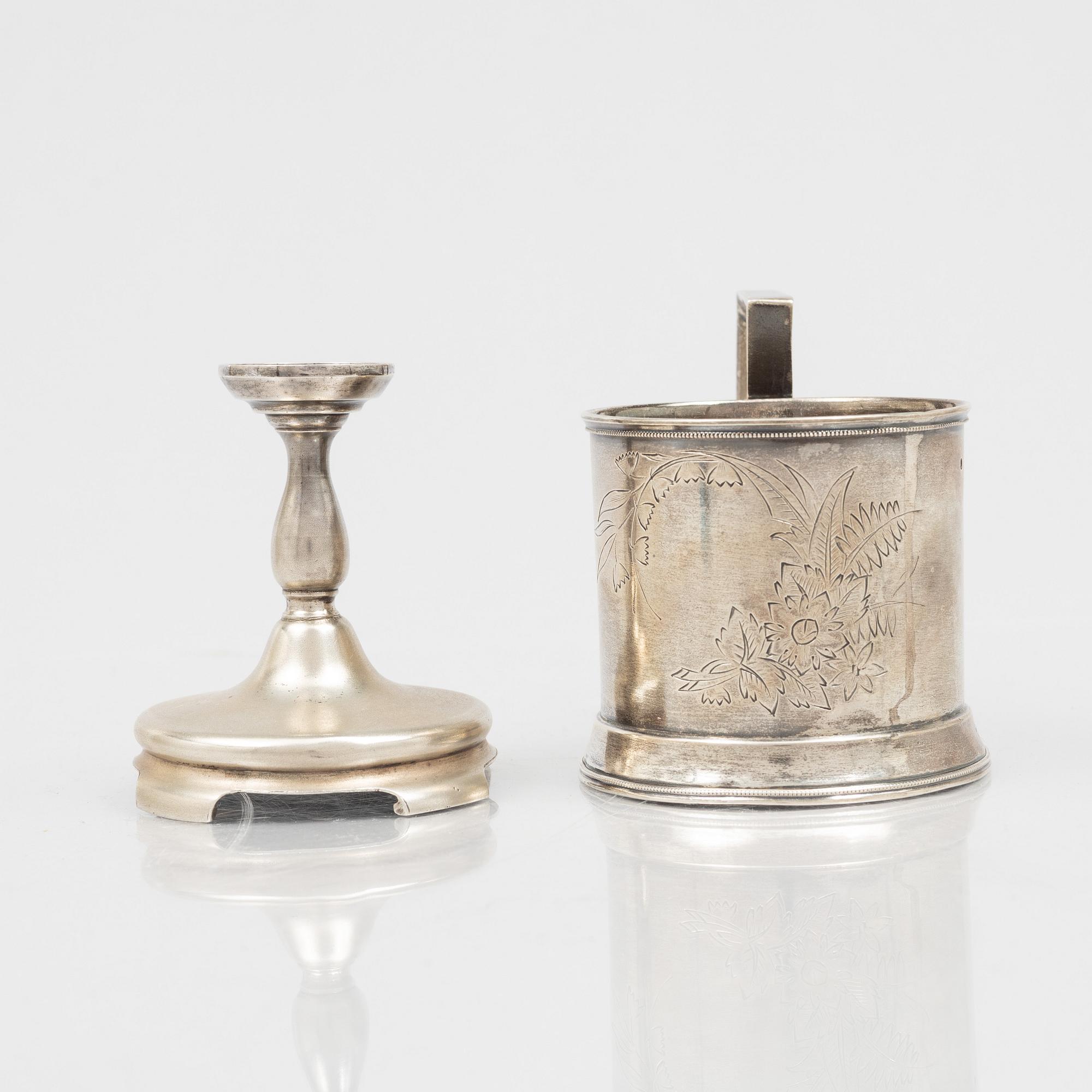 A Russian Silver Candlestick, 1908-26, and a Russian Silver Tea Glass Holder, assay master A. Skovronsky, Moscow 1896.